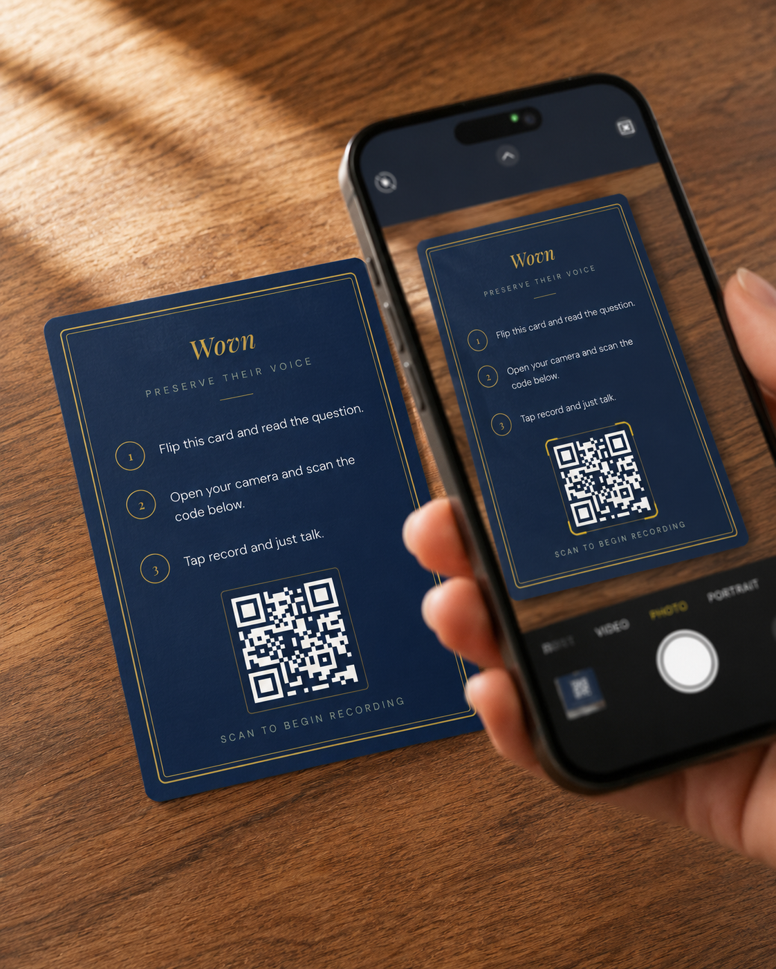 Hand scanning a Wovn card QR code with a phone